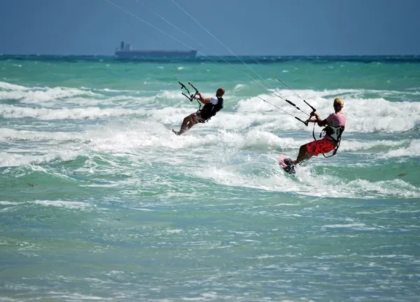 Man and Woman Kite Surfing