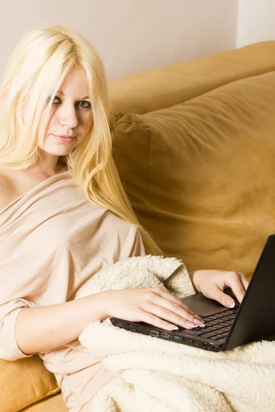Beautiful blonde woman with laptop computer