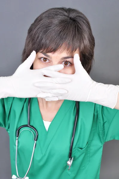 Doctor putting on white sterilized medical glove for making operation