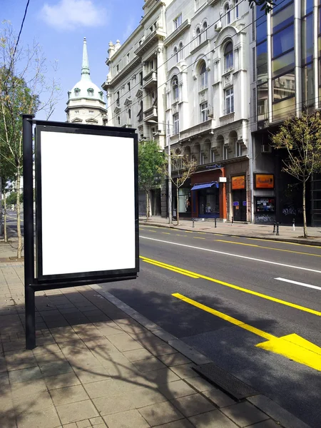 Blank billboard on city bus station