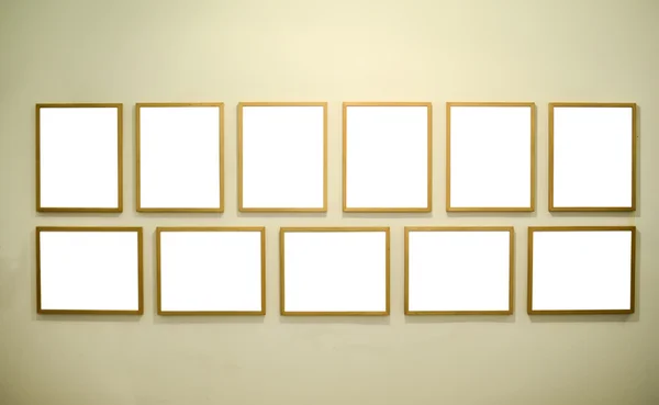 Empty picture frames on gallery wall