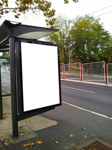 Bus stop with a blank bilboard