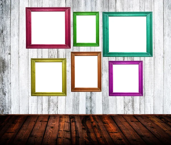Empty room interior with colorful picture frames