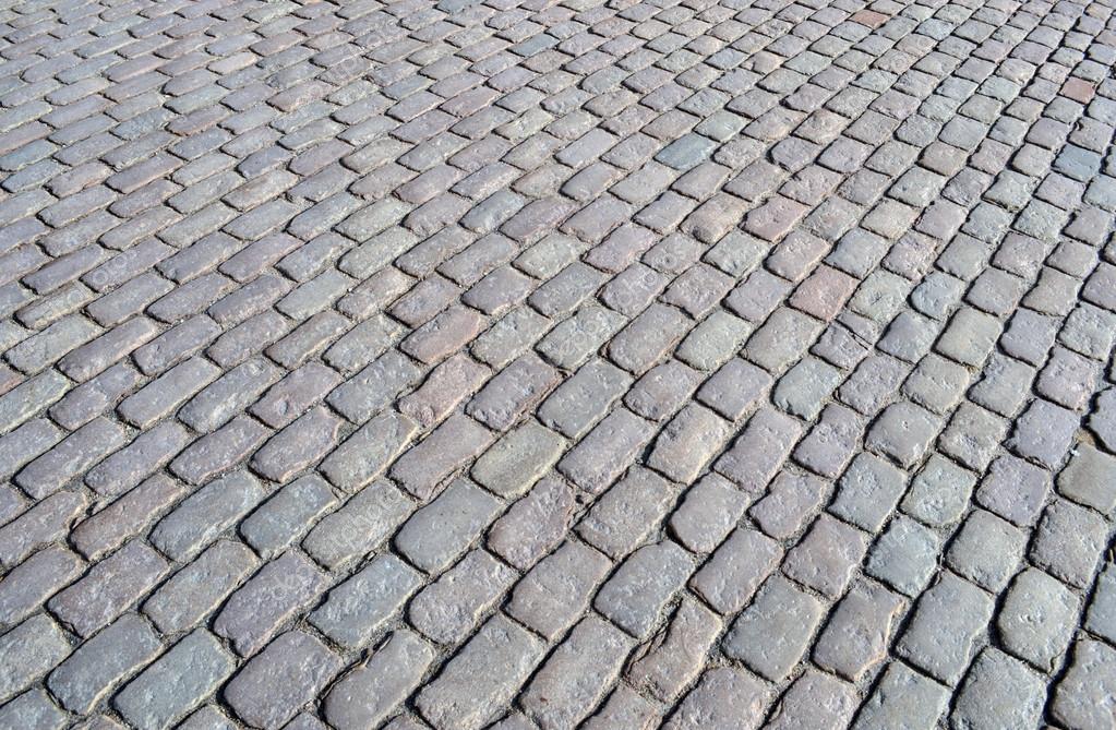depositphotos_22199691-Street-cobblestone-texture.jpg