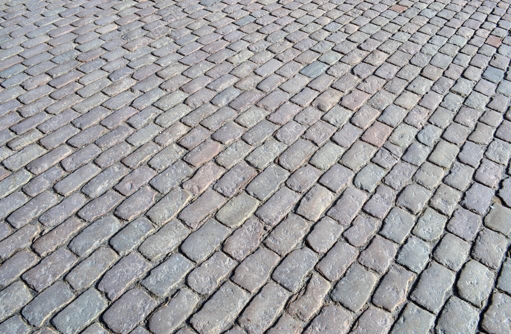 depositphotos_22199691-Street-cobblestone-texture.jpg