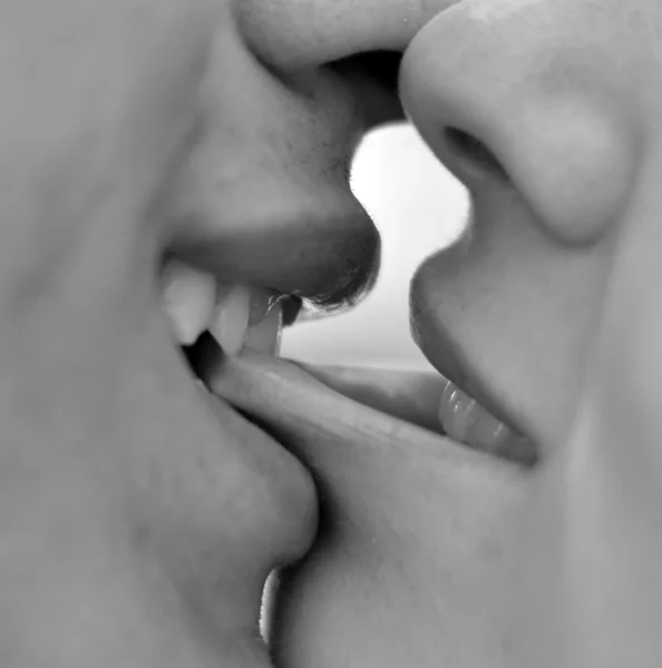 Couple kissing macro shot