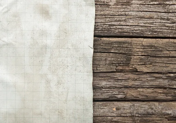 Vintage sheet of graph paper border old wood background