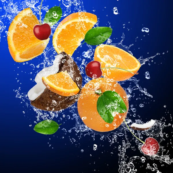 Tropical fruits in water splash