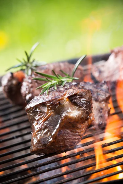 Tasty beef steak on grill