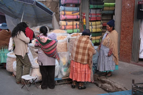 People buy food in a street of La Paz, Bolivia