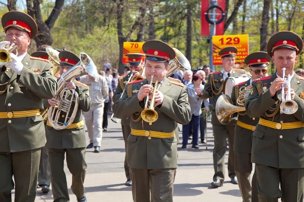 MOSCOW, RUSSIA - MAY 9: Military brass band congratulates war veterans. Celebration of Victory Day in Sokolniki Park on May 09, 2013 in Moscow