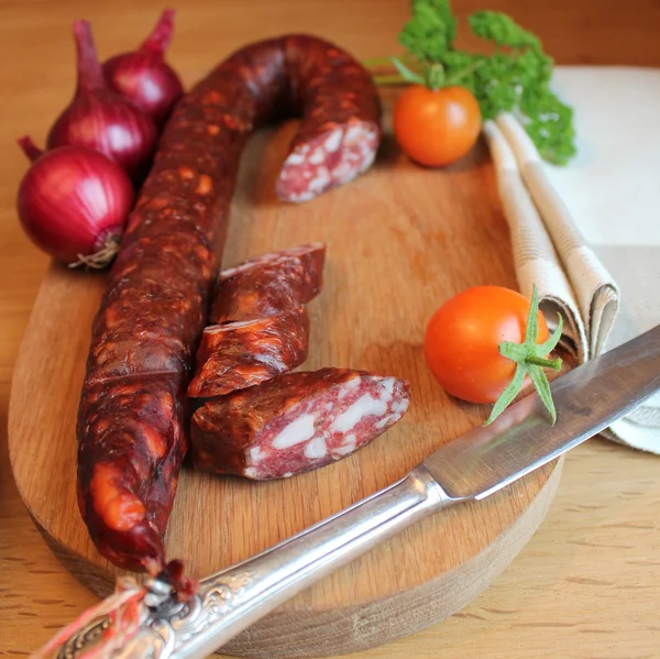 Sausage on a wooden cutting board