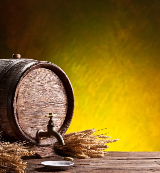 Old oak barrel on a wooden table.