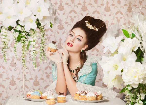 Old fashioned sexy woman with cupcake