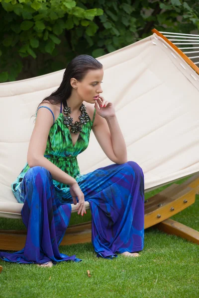 Fashion woman doing yoga exercises on outdoors