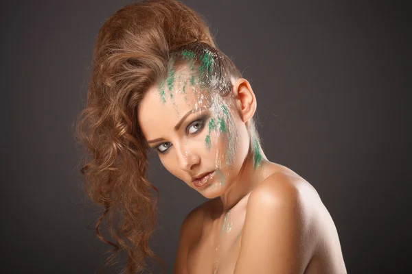Fashion makeup with colored sand shadows, close up studio shot