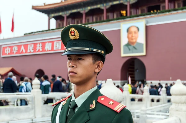 Soldier stands guard in front of Forbidden City in Beijing