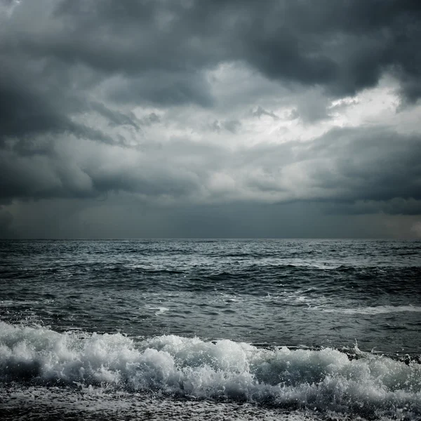Dark storm clouds and sea water