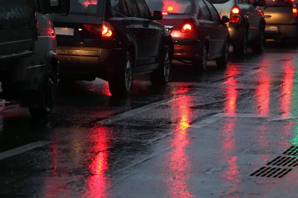 Cars in traffic jam on wet road