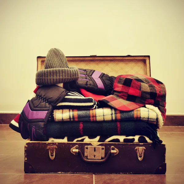 Warming clothes in a suitcase