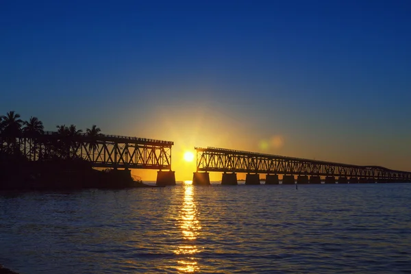 Colorful sunset with broken bridge