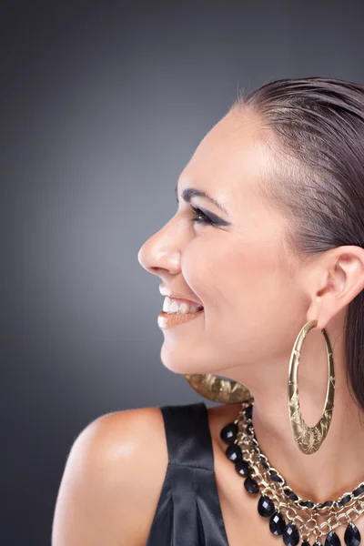 Profile of happy smiling brunette woman in style of Cleopatra