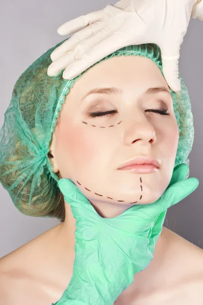 Lines on lady face, as marks for cosmetic plastic surgery
