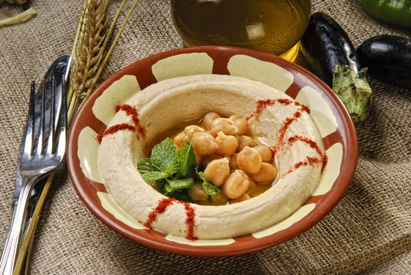 Plate of Arabic traditional hummus with peas grains