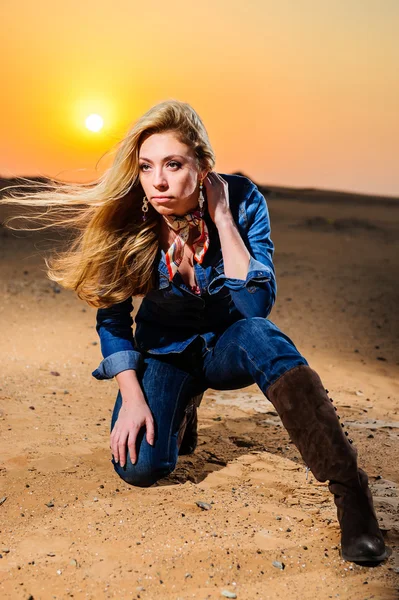 Portrait of beautiful country girl in front of red sunset