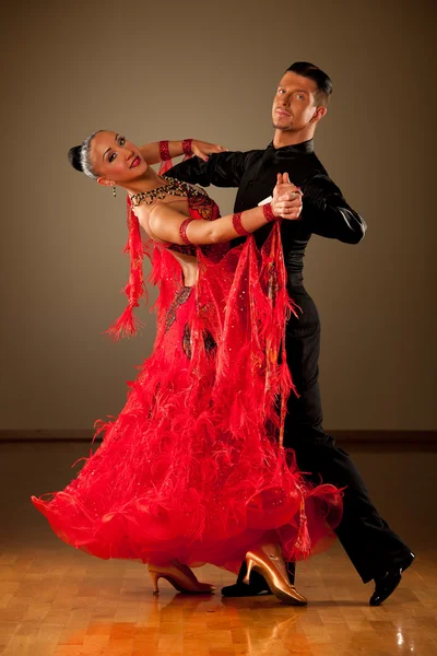 Professional ballroom dance couple preform an exhibition dance