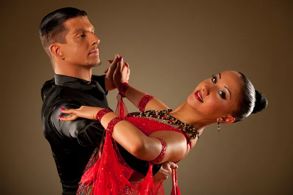 Professional ballroom dance couple preform an exhibition dance