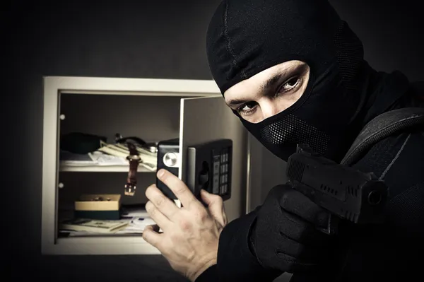 Professional burglar in black mask
