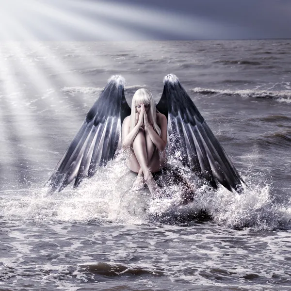 Woman with dark angel wings