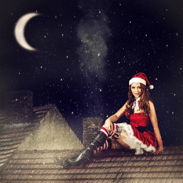 Christmas fairy woman in red dress and santa hat