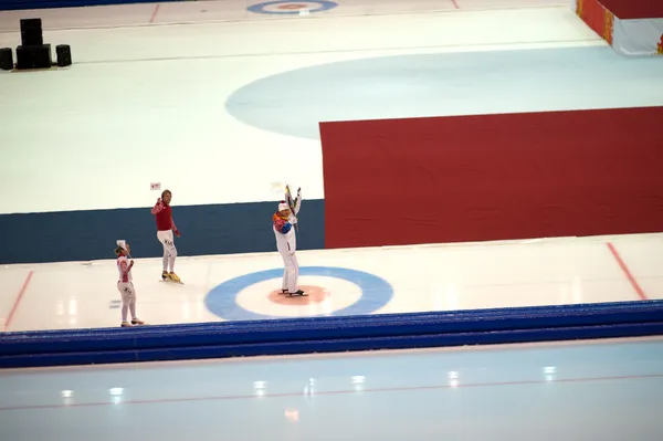 Valery Muratov, Russia coach holding Olympic torch