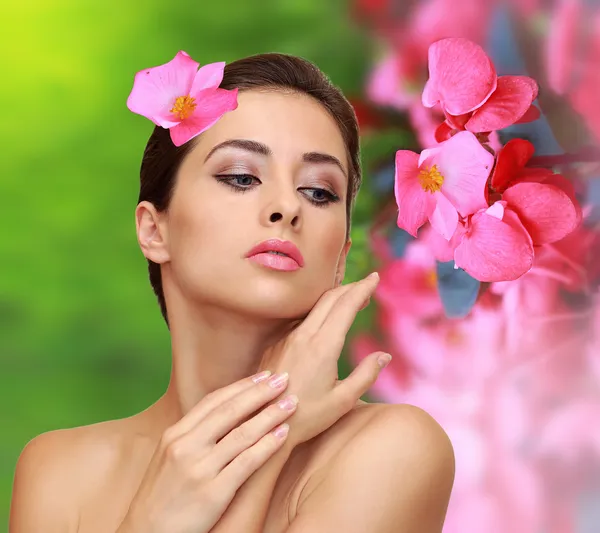 http://st.depositphotos.com/1023162/3026/i/450/depositphotos_30265767-stock-photo-beautiful-woman-with-pink-flowers.jpg