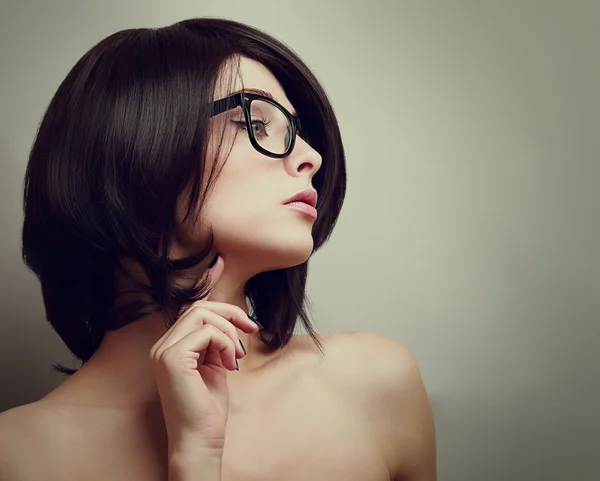 Sexy profile of thinking woman in glasses. Closeup vintage portrait