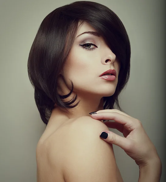 Sexy makeup woman. Black short hair style. Vintage portrait