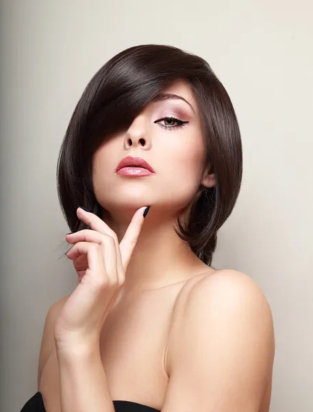 Sexy thinking alluring girl with short black hair