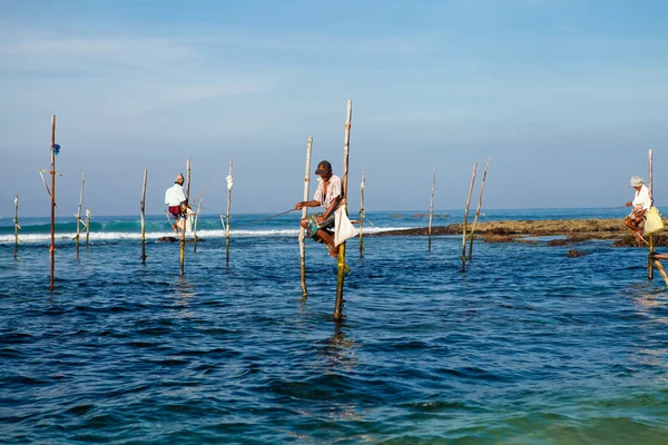 Sri Lankan traditional fisherman on stick in the Indian ocean