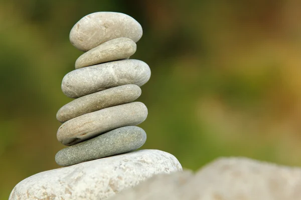 Balanced stones over nature background