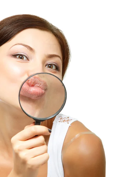 Woman give kiss through a magnifying glass