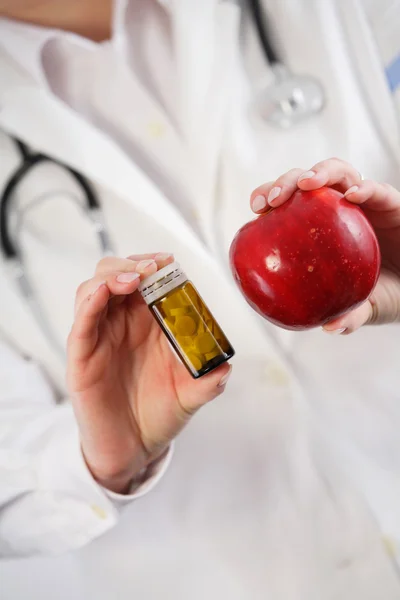 Apple vs. drugs in doctor\'s hands