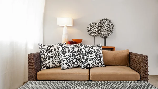 Beige brown sofa in interior setting