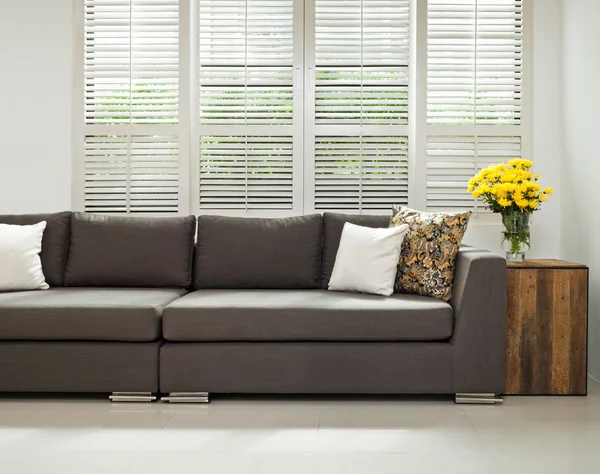 Grey sofa in simple setting