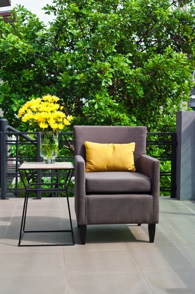 Outdoor patio seating are with nice Rattan sofa at sunset