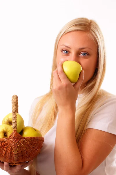 Beautiful blonde woman eating apple