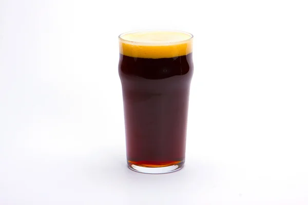 Dark beer in mug Objects on white background