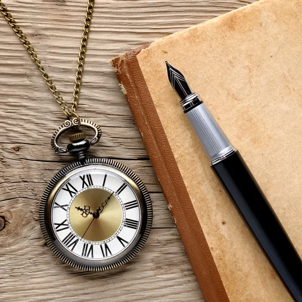Antique watch, fountain pen and notebook