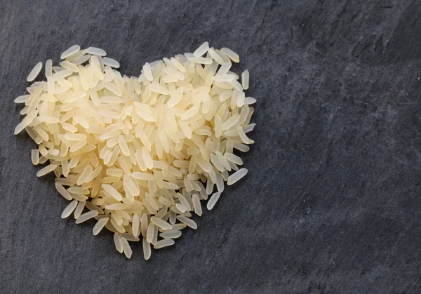 Pile of white rice in heart shape